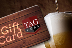 A TAG Gift Card for the Pub in front of a beer.